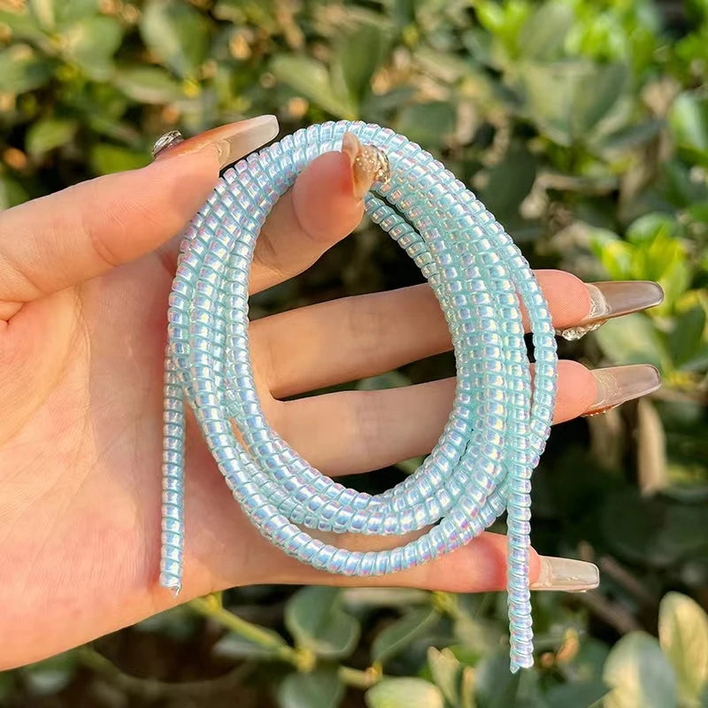 Colorful Spiral Cable Protector for All Devices.”